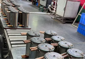 Heat exchanger vessels moving along a production line in the factory